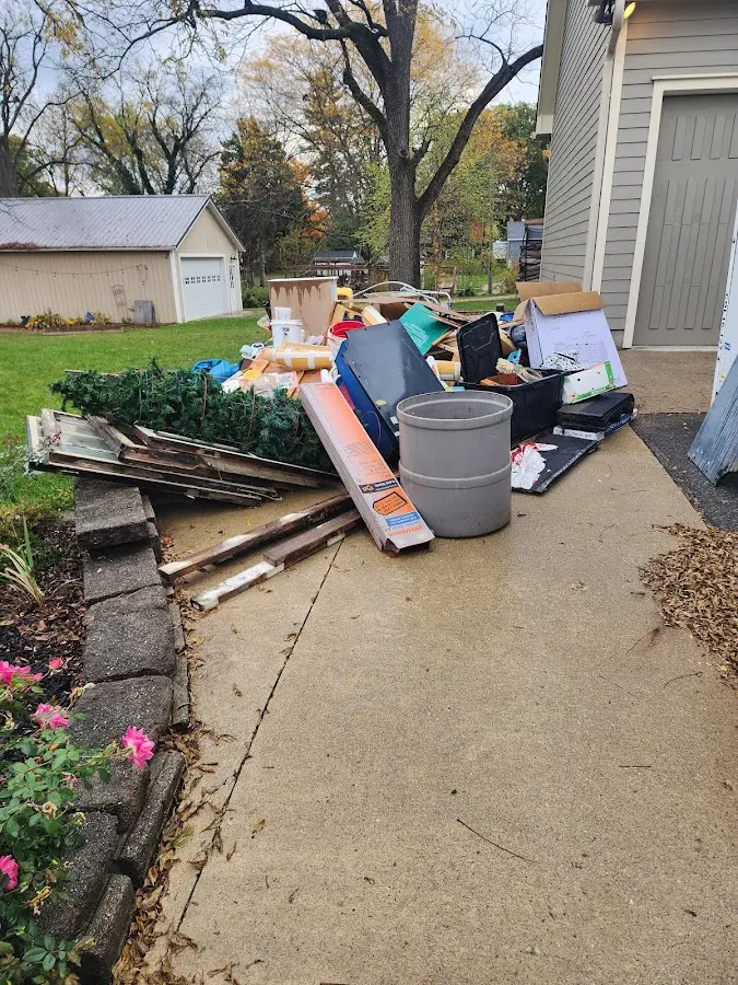 Dumpster being loaded with debris for Residential Dumpster Rental in Los Ranchos de Albuquerque